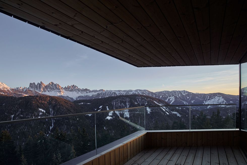 a wooden deck overlooking a mountain range