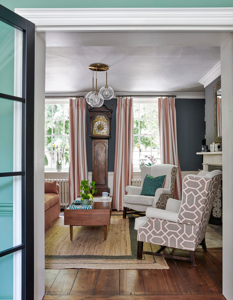 formal living room with wing back chairs