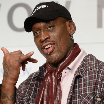 dennis rodman on red carpet with basketball