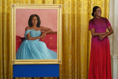 michelle obama stands next to her newly unveiled official white house portrait