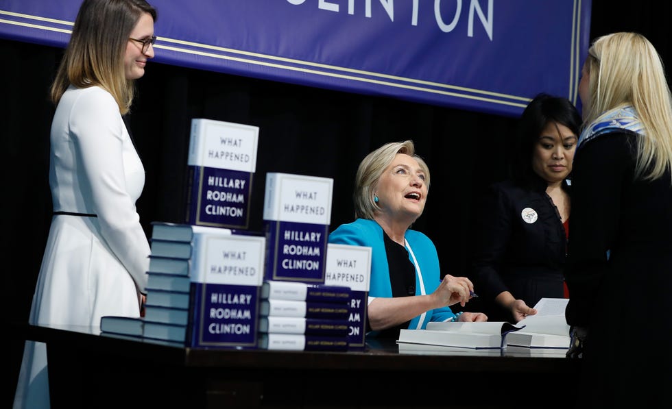 hillary clinton signs copies of what happened