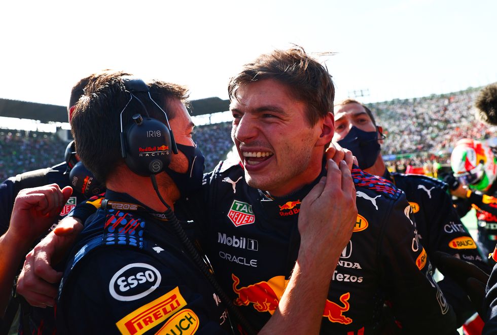 formula 1 driver max verstappen celebrates a race win with his red bull mechanics