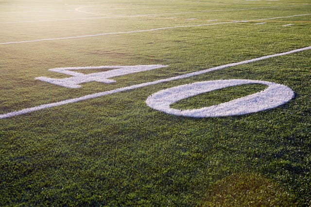 forty yard line on green playing field