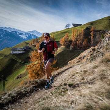 a man running on a trail a man running on a trail