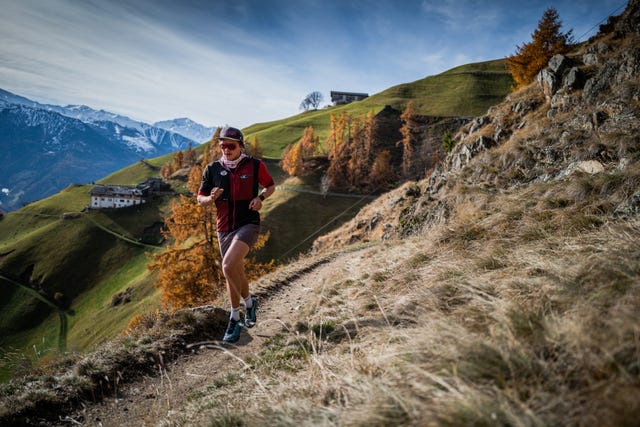 a man running on a trail