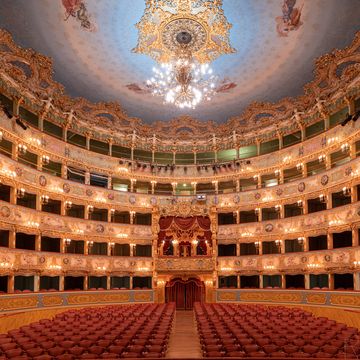 a large building with a large dome with la fenice in the background