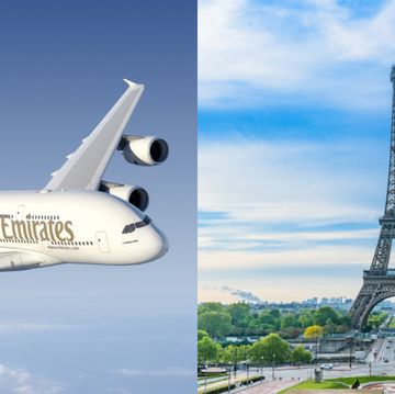 a plane flying in front of the eiffel tower