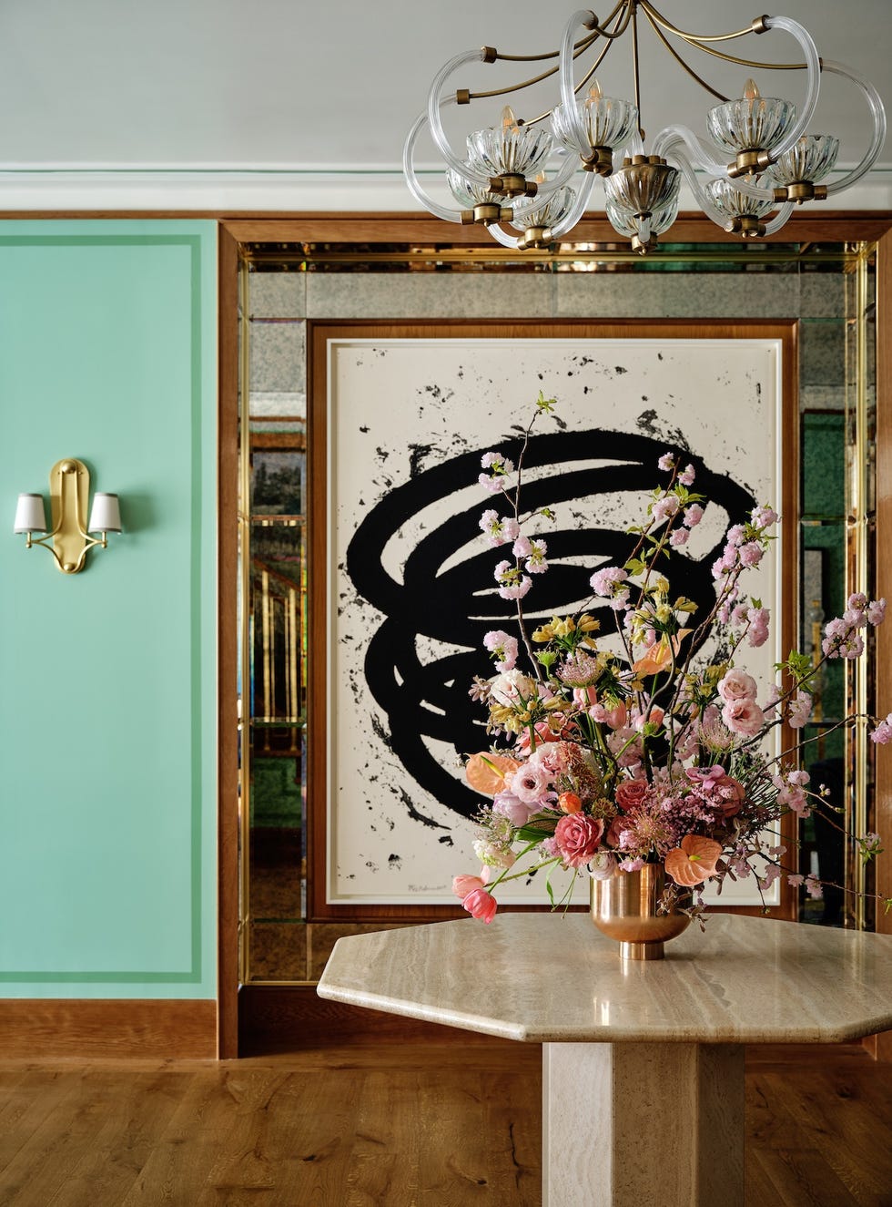 interior scene featuring a flower arrangement wall art and stylish decor elements