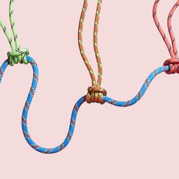 four coloured ropes supporting a larger rope