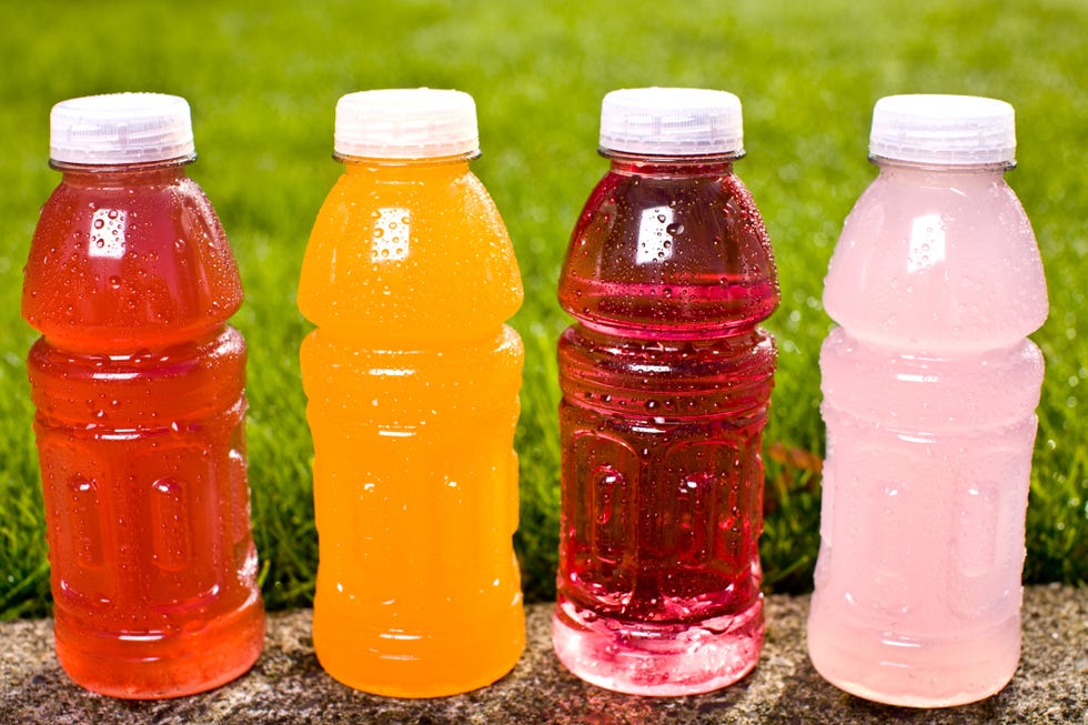 four multi colored sports drinks
