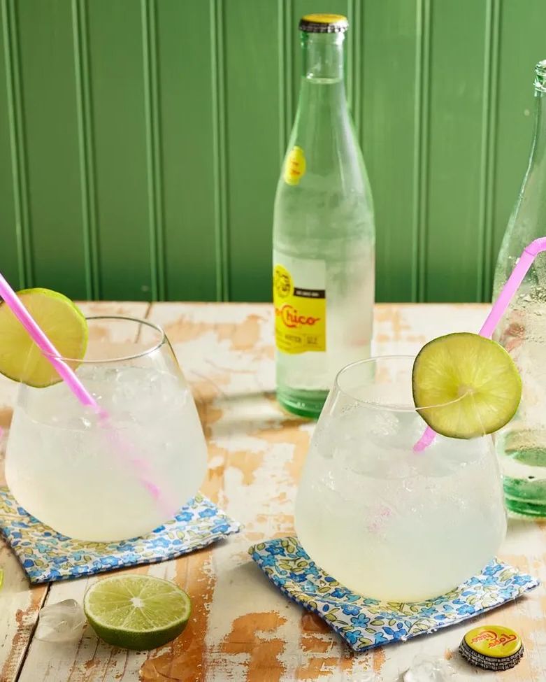 ranch water with pink straws limes and topo chico