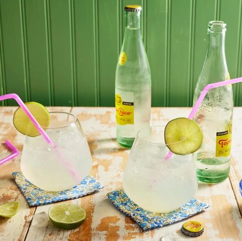 ranch water with pink straws limes and topo chico