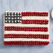 fourth of july flag cake with red white and blue linen napkin forks and plate