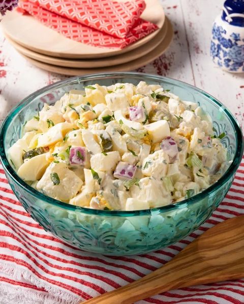 instant pot potato salad in blue glass bowl  with wood spoon