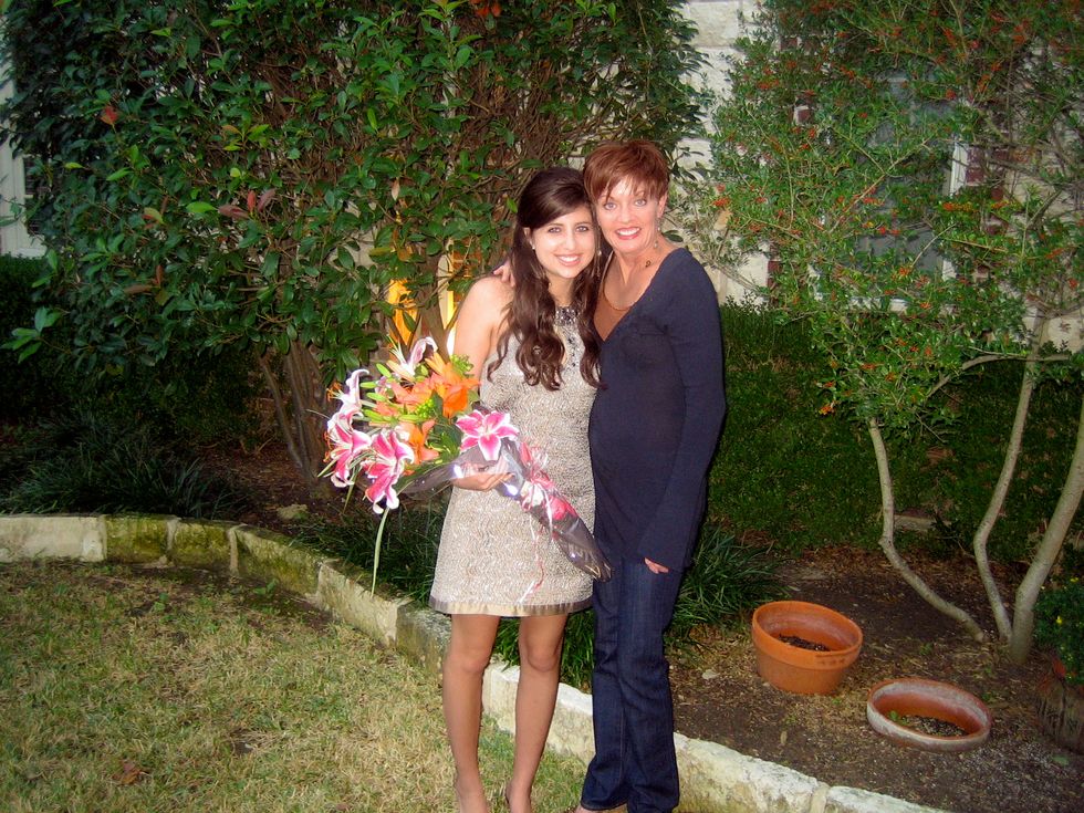 margaux, holding a bouquet of lilies, with her mother in 2007