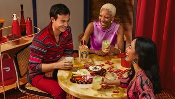 group enjoying drinks and food at a table