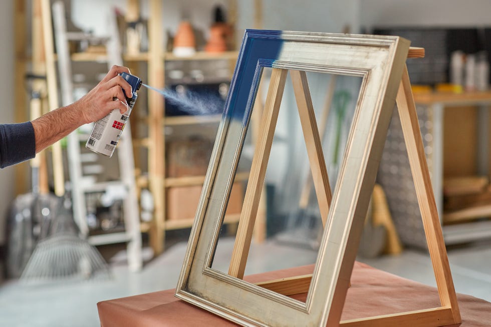 spray painting a frame blue