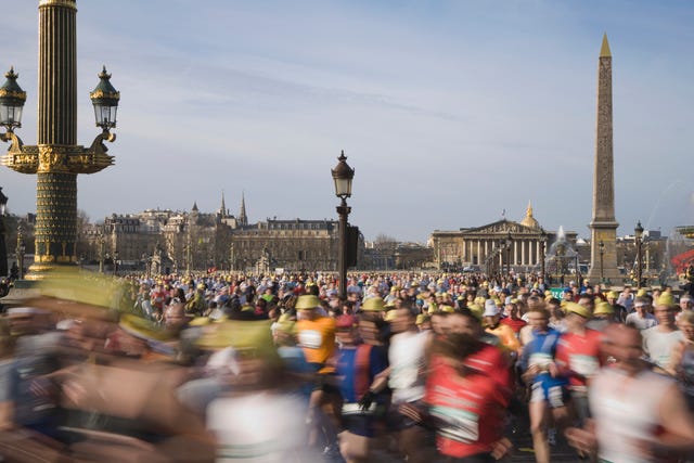 France, Paris, runners in Paris Marathon crossing Place de la Concorde