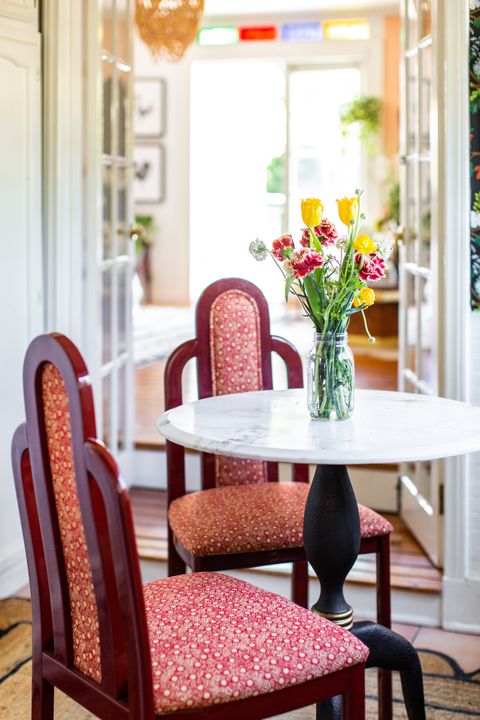 breakfast nook with red upholstered chairs