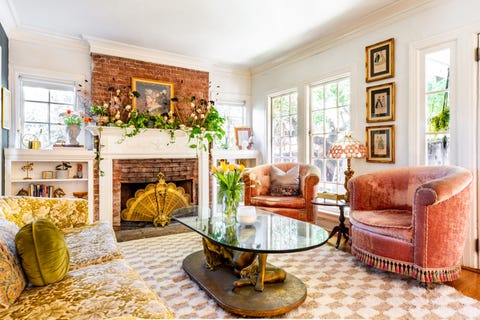 living room with pink velvet chairs and bronze accents