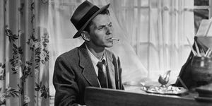 in a classic pose, frank sinatra smokes a cigarette as he plays piano in the movie young at heart one of the movies songs became a trademark saloon song for sinatra make it one for my baby and one more for the road, by harold arlen and johnny mercer