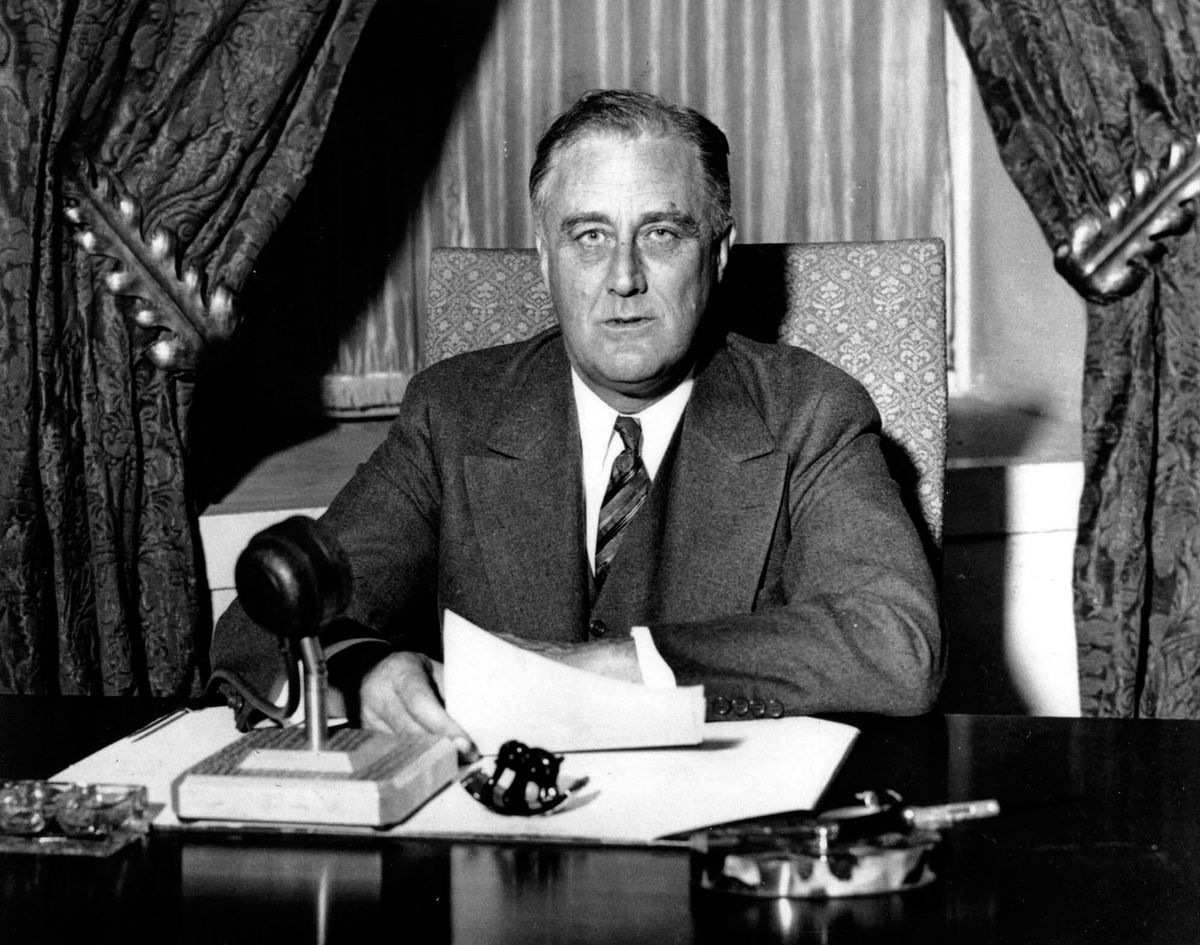 franklin-delano-roosevelt-1882-1945-32nd-president-of-the-united-states-of-america-1933-1945-giving-one-of-his-fireside-broadcasts-to-the-american-nation-during-photo-by-universal-history-archivegetty.jpg