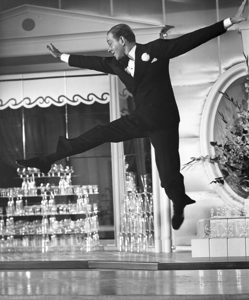 fred astaire dances along a bar in a scene from the film the sky's the limit