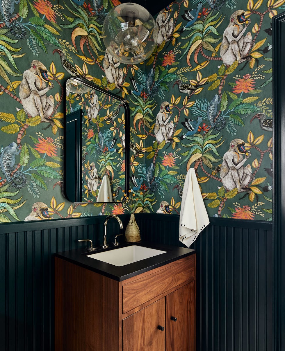 a bathroom with a wall mural
