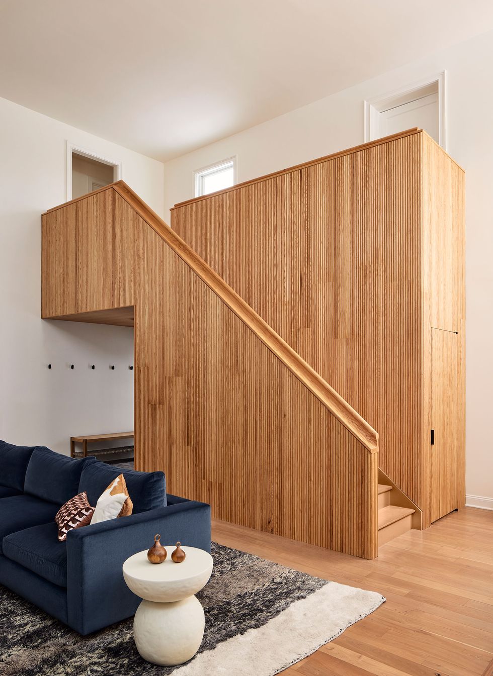 a room with a wood wall