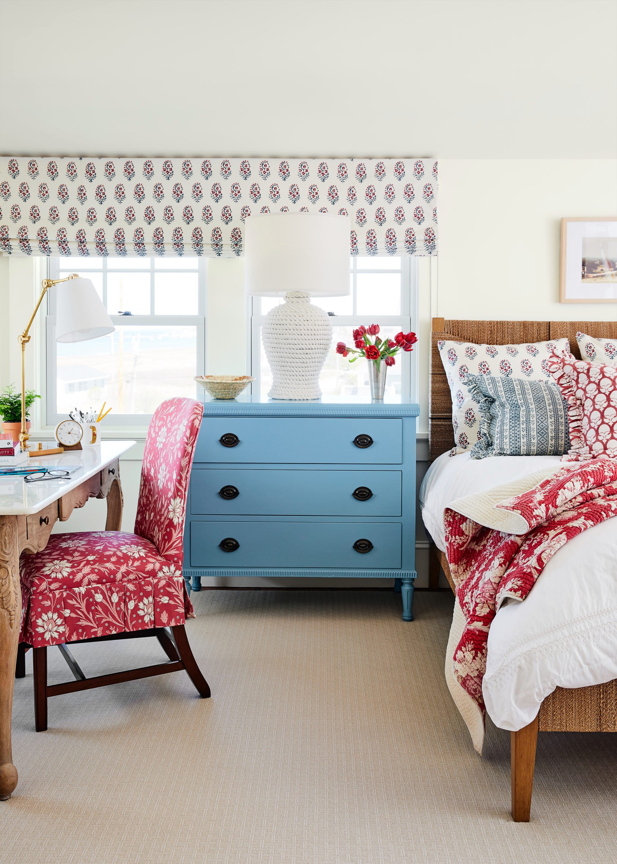 primary bedroom with blue and red accents.