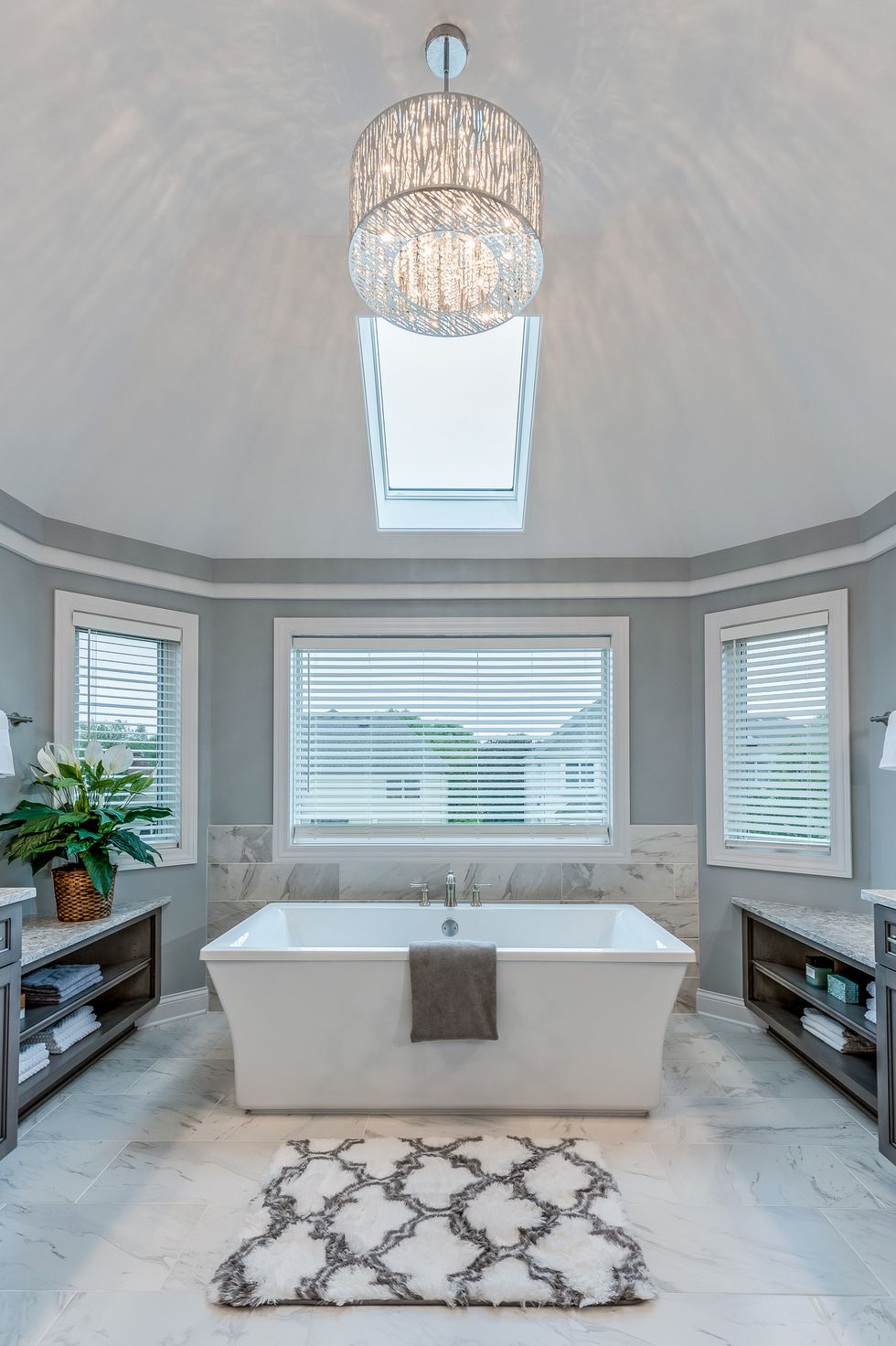 freestanding bathtub sitting perfectly beneath skylight
