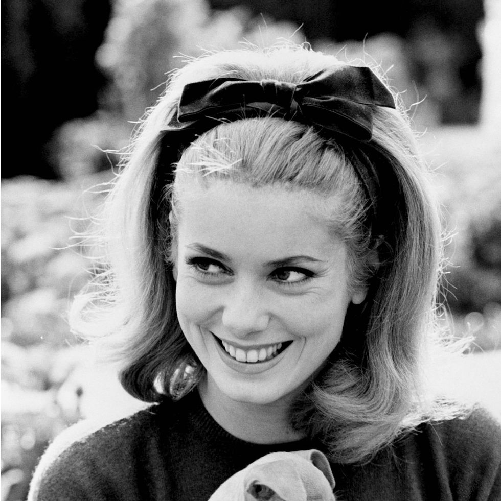 french actress catherine deneuve holding a puppy, circa 1962 photo by silver screen collectiongetty images