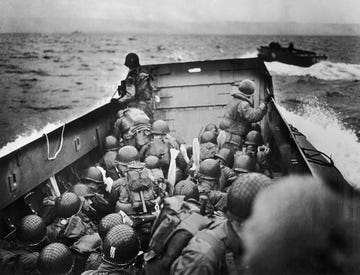 american troops riding barge to normandy