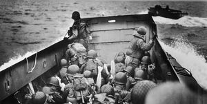american troops riding barge to normandy