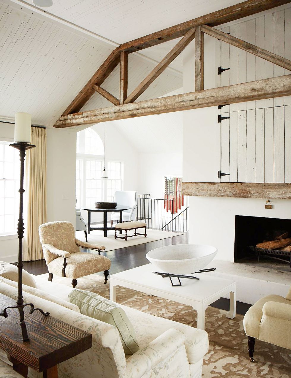 white living room with exposed beams
