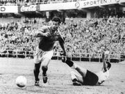 just fontaine handles soccer ball next to goalkeeper on ground