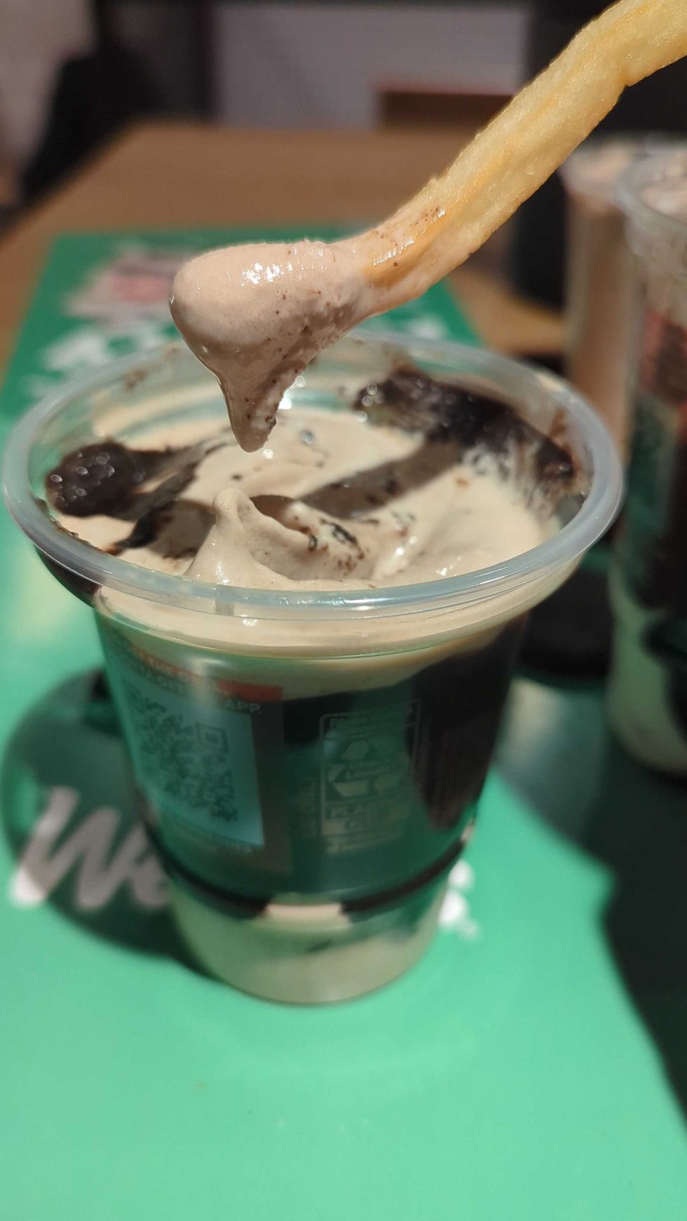 wendy's thin mint frosty with a french fry dipped into it