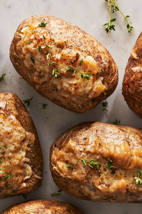 baked potatoes filled with french onion soup inspired fillings and topped with fresh thyme
