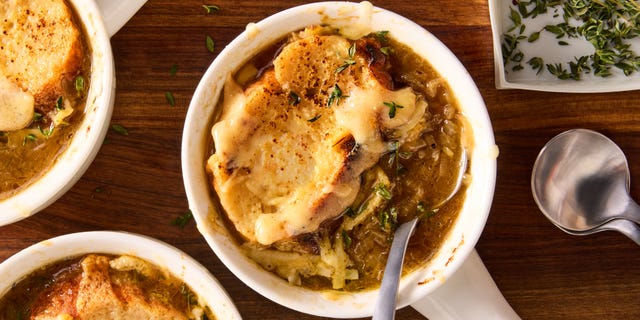 french onion soup with melted cheese and bread slices