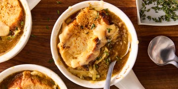 french onion soup with melted cheese and bread slices