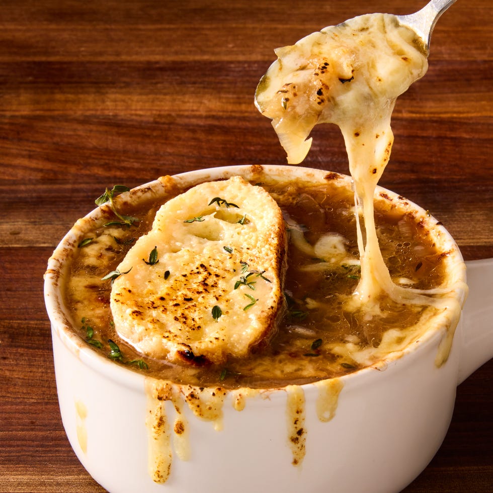 french onion soup with melted cheese and bread slices