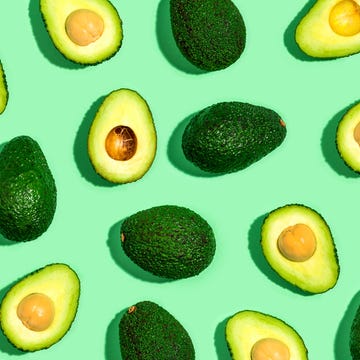 Fresh avocado pattern on a green background