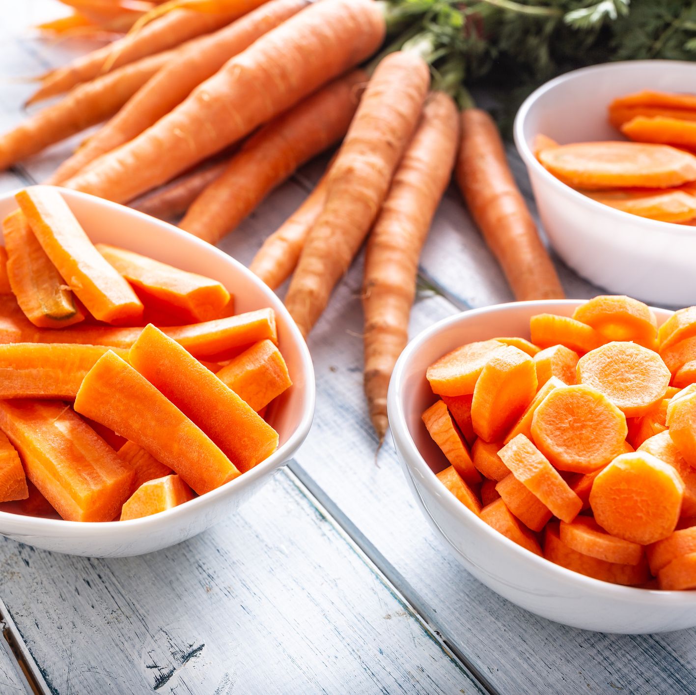fresh carrot and carrots slices on table