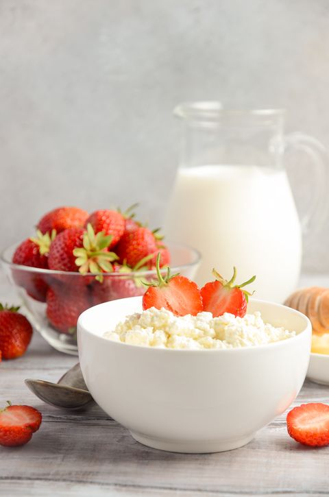 Fresh cottage cheese with fresh strawberries, healthy breakfast concept