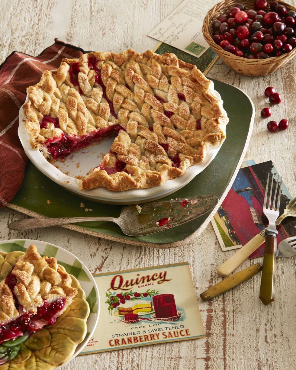 cranberry orange pie in a white pie plate with a slice removed
