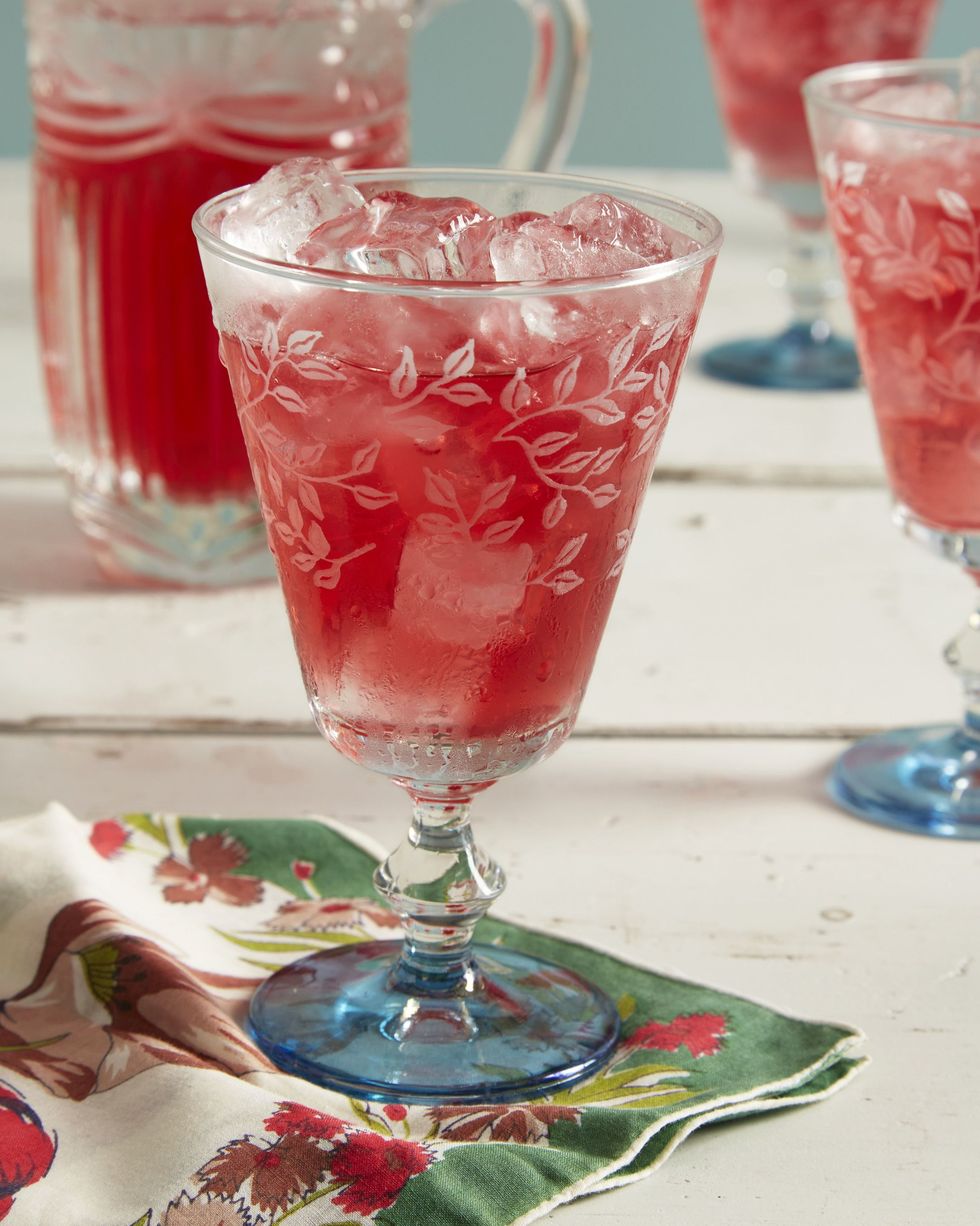 cranberry ginger shrub in a glass with ice