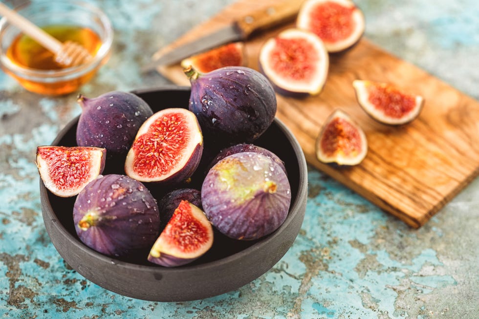 fresh figs and honey on rustic background