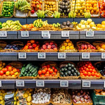 fresh fruits and vegetables on a market stall for sale at the supermarket