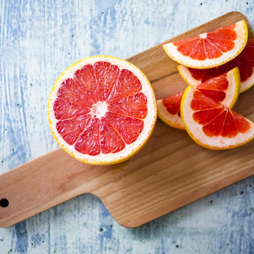 fresh grapefruit on chopping board
