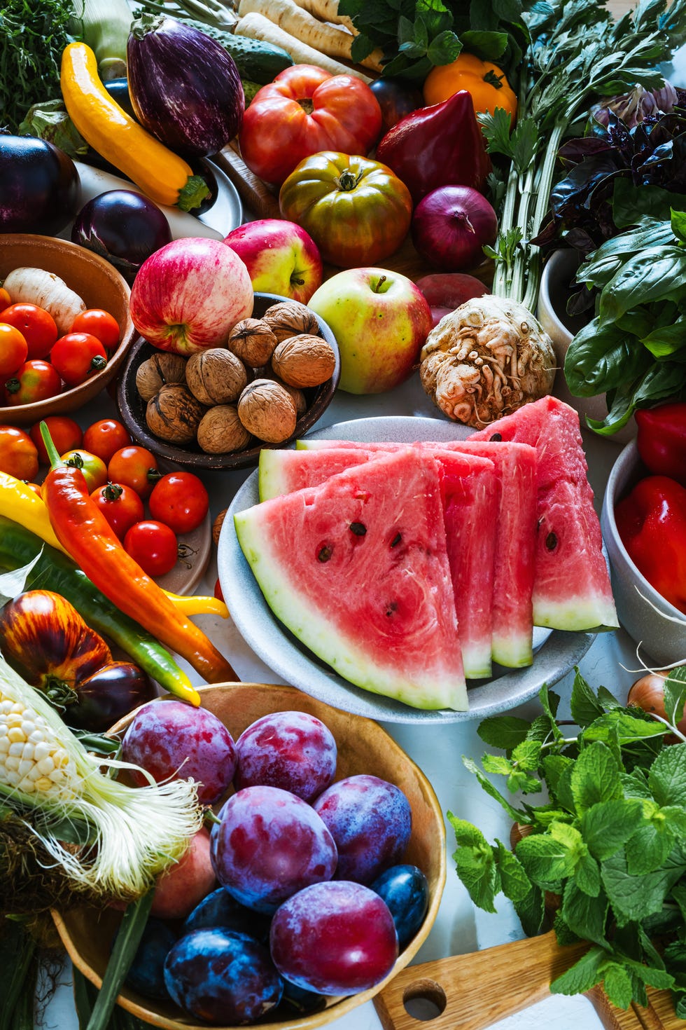 fresh homegrown vegetables and fruits on kitchen table, summer harvest still life, full frame